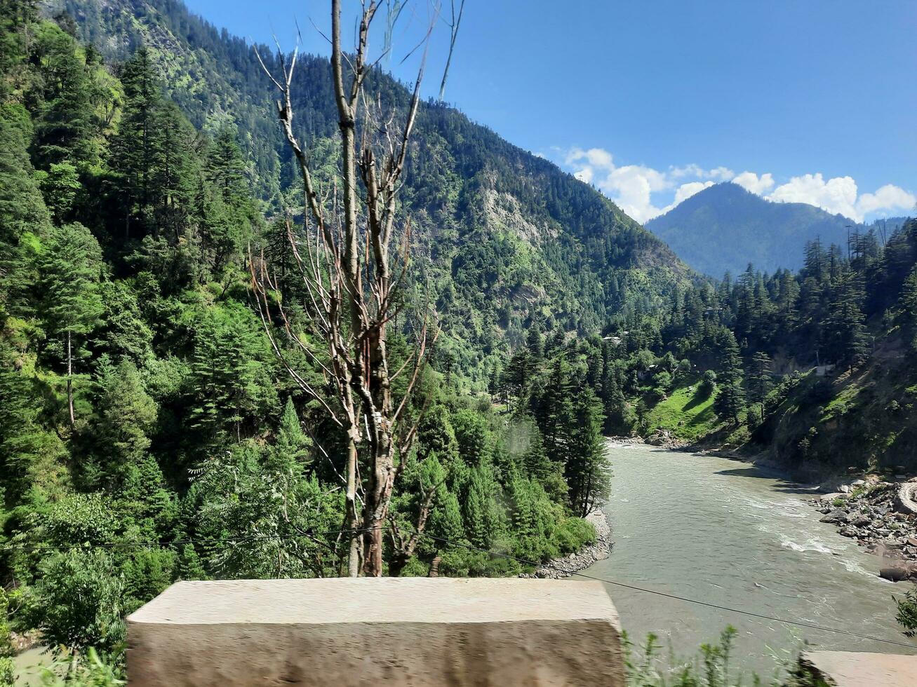 Beautiful day time view of Keran Valley, Neelam Valley, Kashmir. Green valleys, high mountains and trees are visible. photo