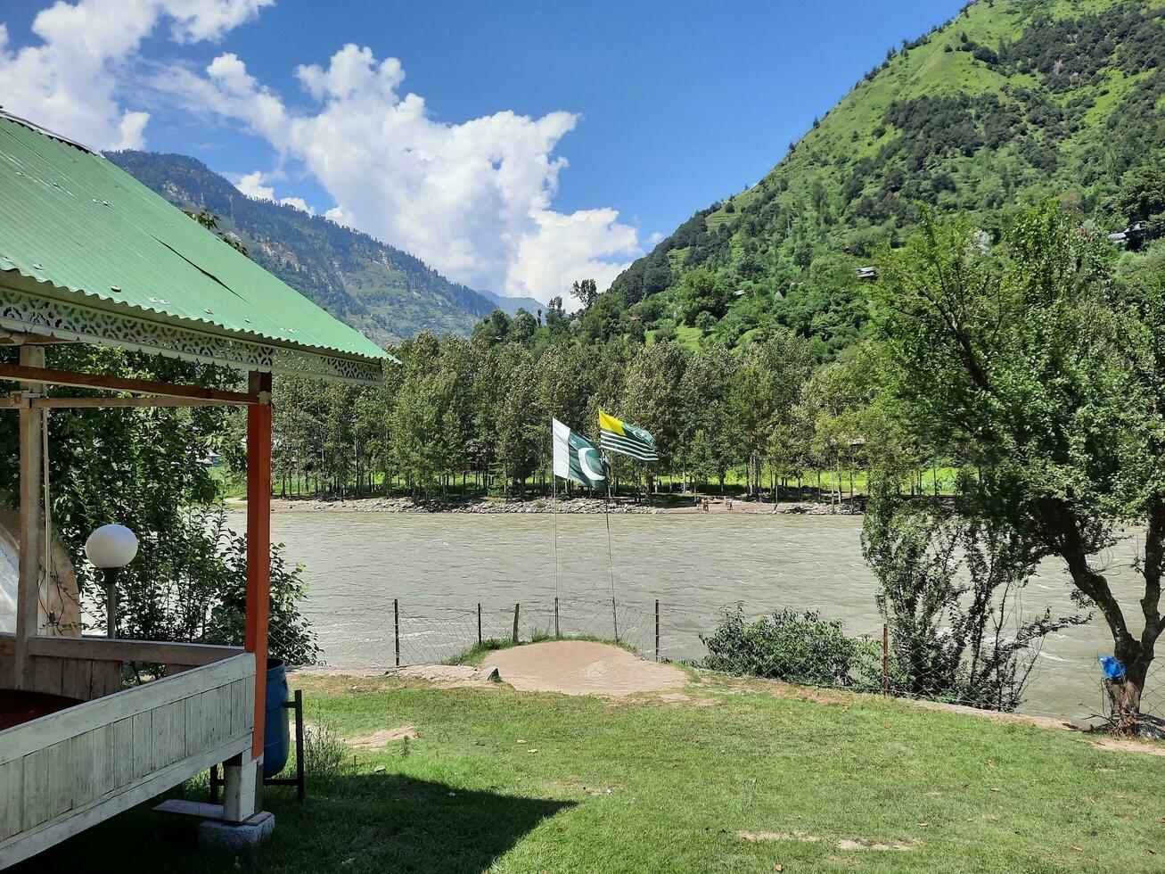 Beautiful day time view of Keran Valley, Neelam Valley, Kashmir. Green valleys, high mountains and trees are visible. photo