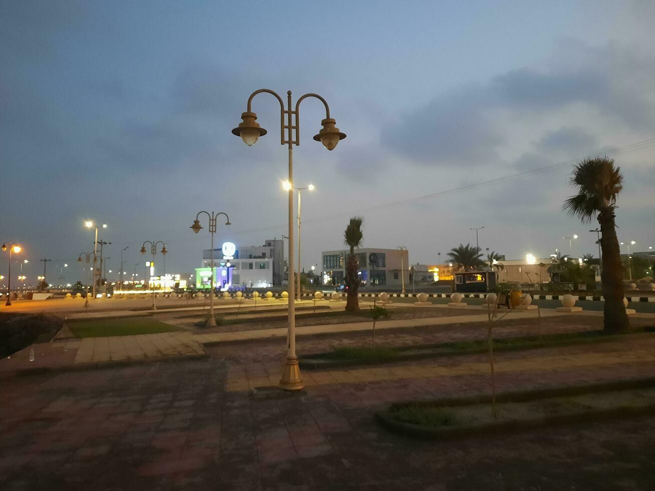 Beautiful morning view of Al Qunfudhah Beach, Saudi Arabia. The lights on the beach are creating a beautiful scene in the morning. photo