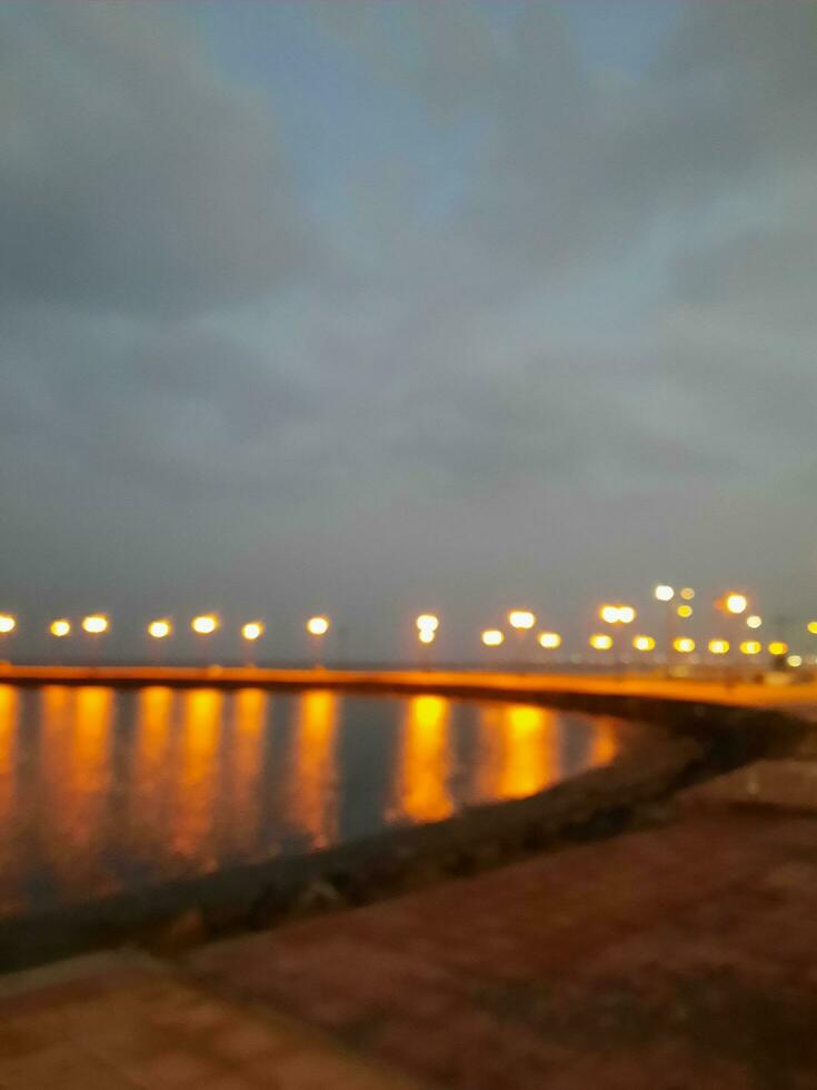 Beautiful morning view of Al Qunfudhah Beach, Saudi Arabia. The lights on the beach are creating a beautiful scene in the morning. photo