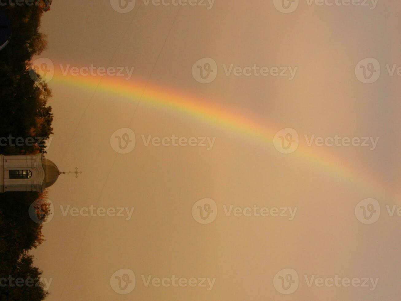 Blue sky and white cloud with sun light and rainbow photo