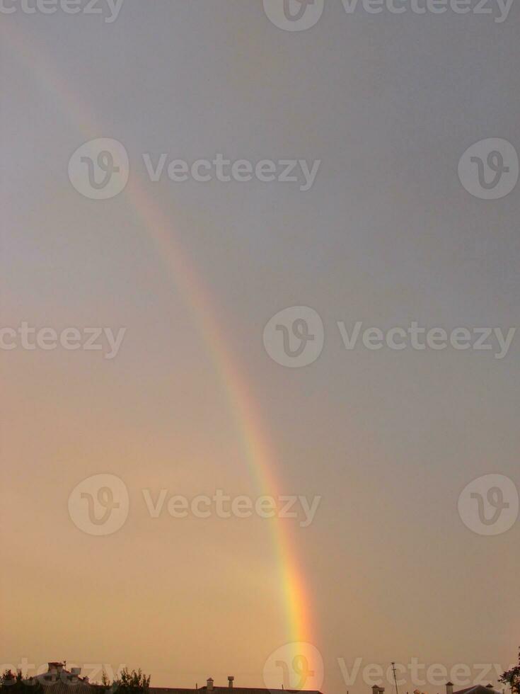 Blue sky and white cloud with sun light and rainbow photo