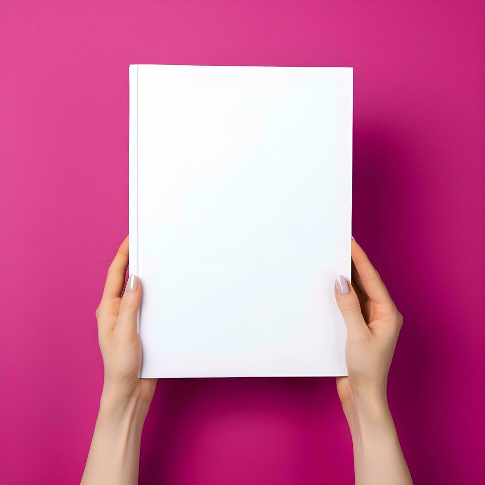 Woman hand holding book with blank cover on pink background, top view. generative ai photo