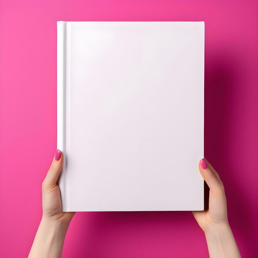 Woman hand holding book with blank cover on pink background, top view. generative ai photo