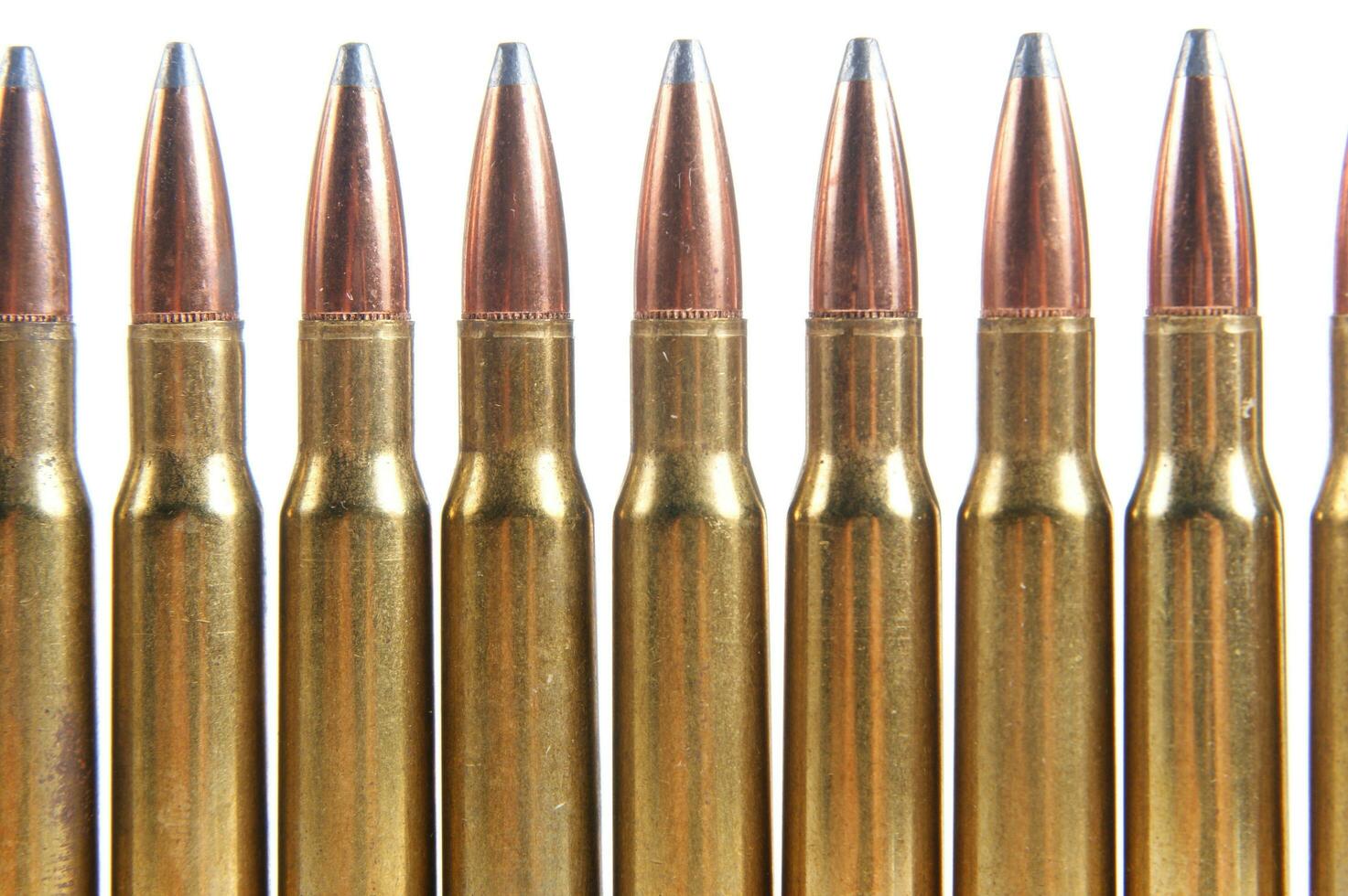 a row of bullet cartridges on a white background photo