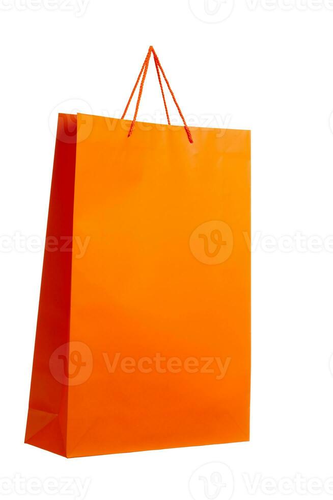 Orange paper bag on white. photo