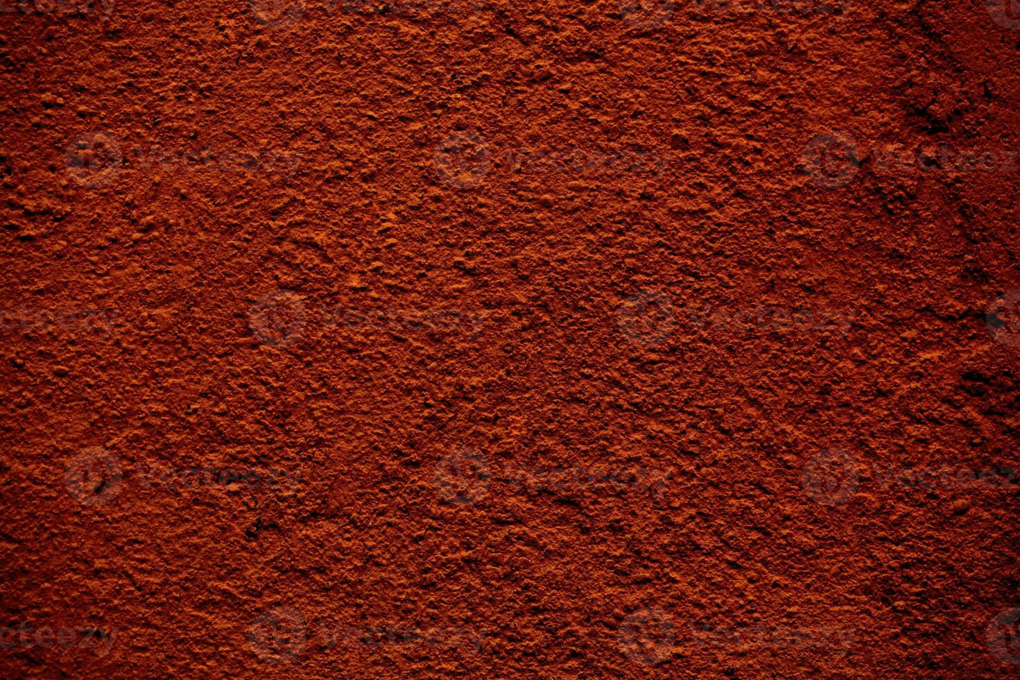 Background texture of a rough finish concrete wall photo