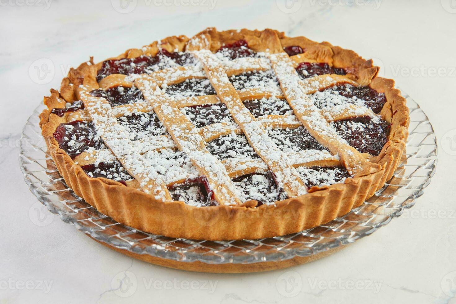 Elegant Delicacy, Classic Linzer Cake with Cherry on Marble. Delectable Traditions, Cherry-Topped Linzer Cake on Marble Background photo