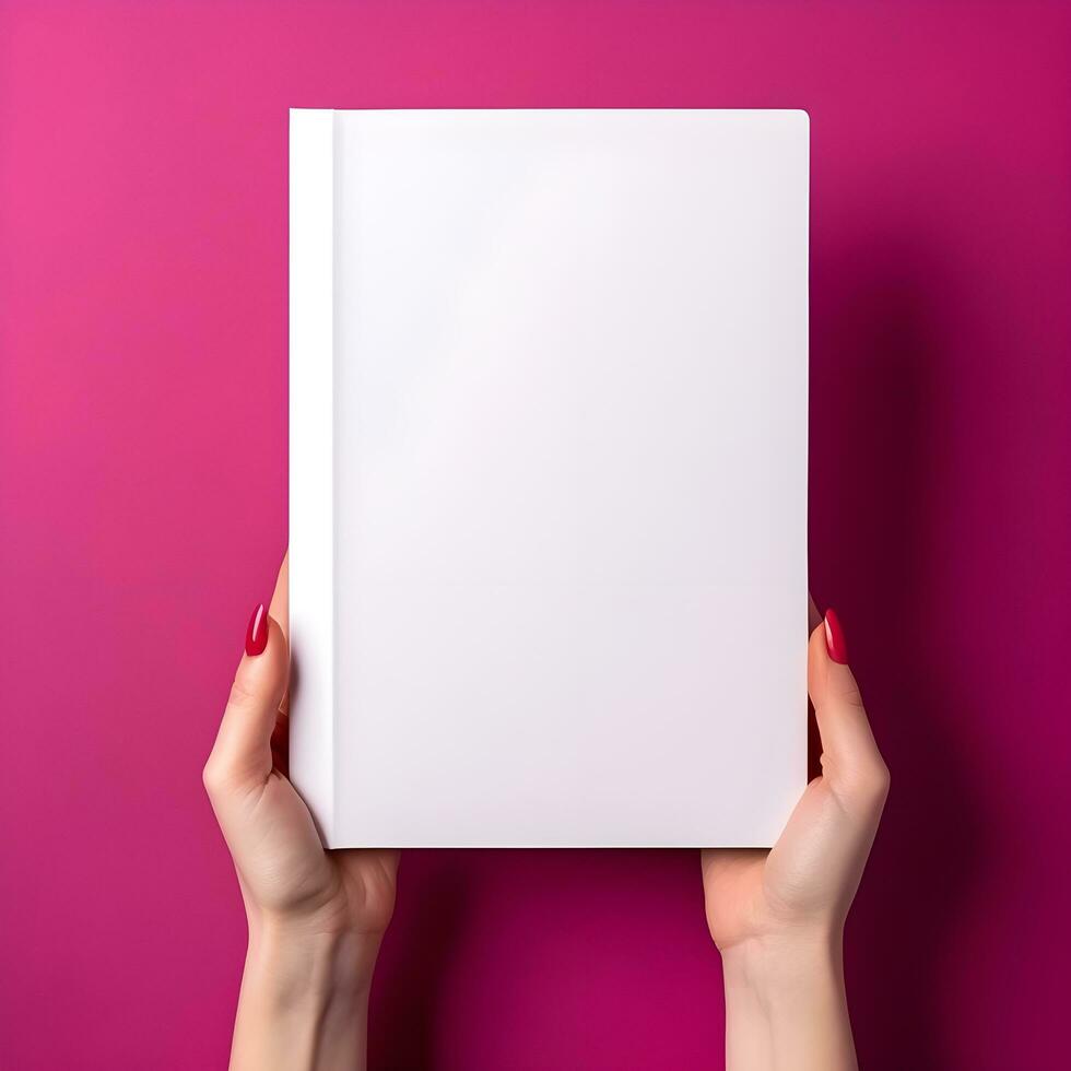 Woman hand holding book with blank cover on pink background, top view. generative ai photo