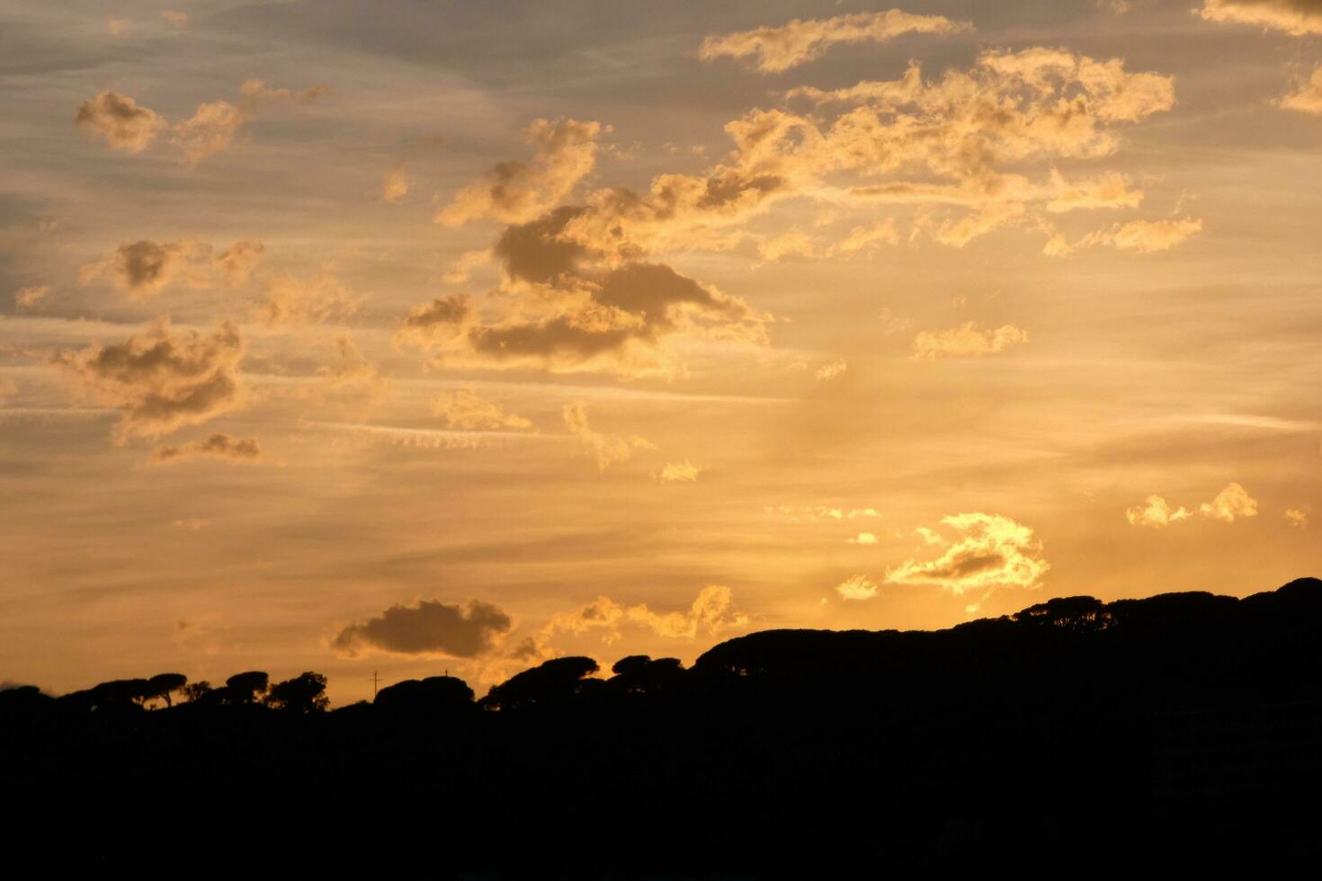 Scattered clouds in the sky indicating a change in weather. photo
