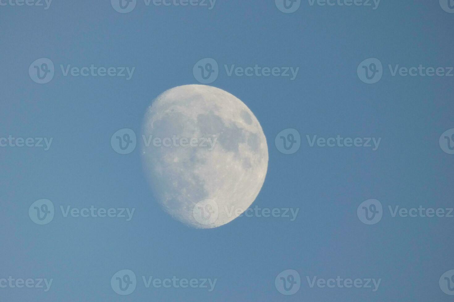 Moon seen during the day in crescent photo