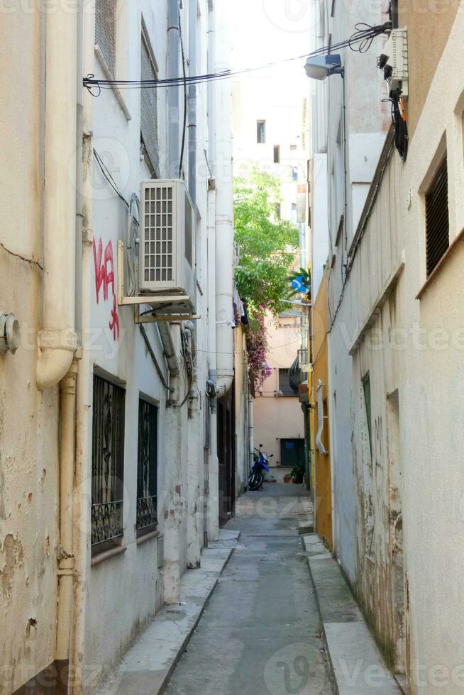 Narrow streets in the old quarter of the Mediterranean town of Blanes in the province of Barcelona, Catalonia, Spain. photo