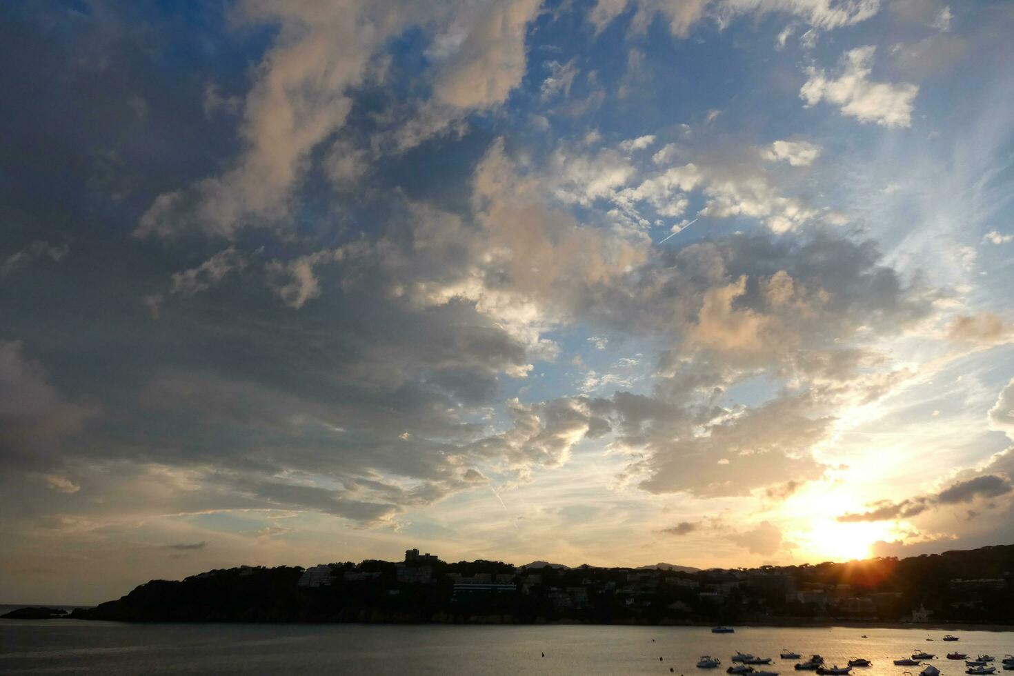 Scattered clouds in the sky indicating a change in weather. photo