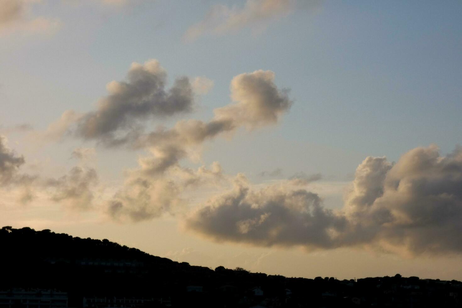 Clouds and light effects in the sky at dawn or dusk. photo