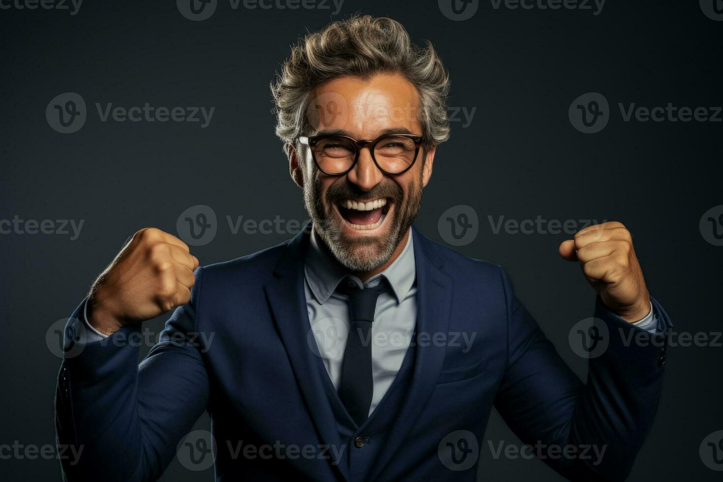 Excited male portrait celebrating success with a triumphant fist photo