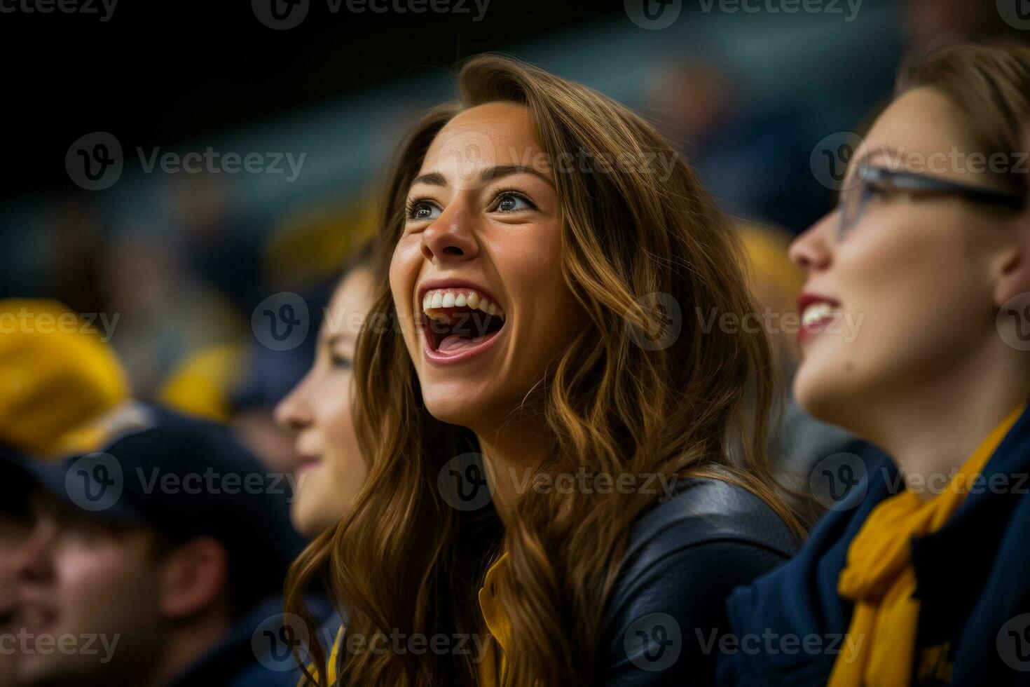 Supportive mother enthusiastically cheers for her daughters team during games photo