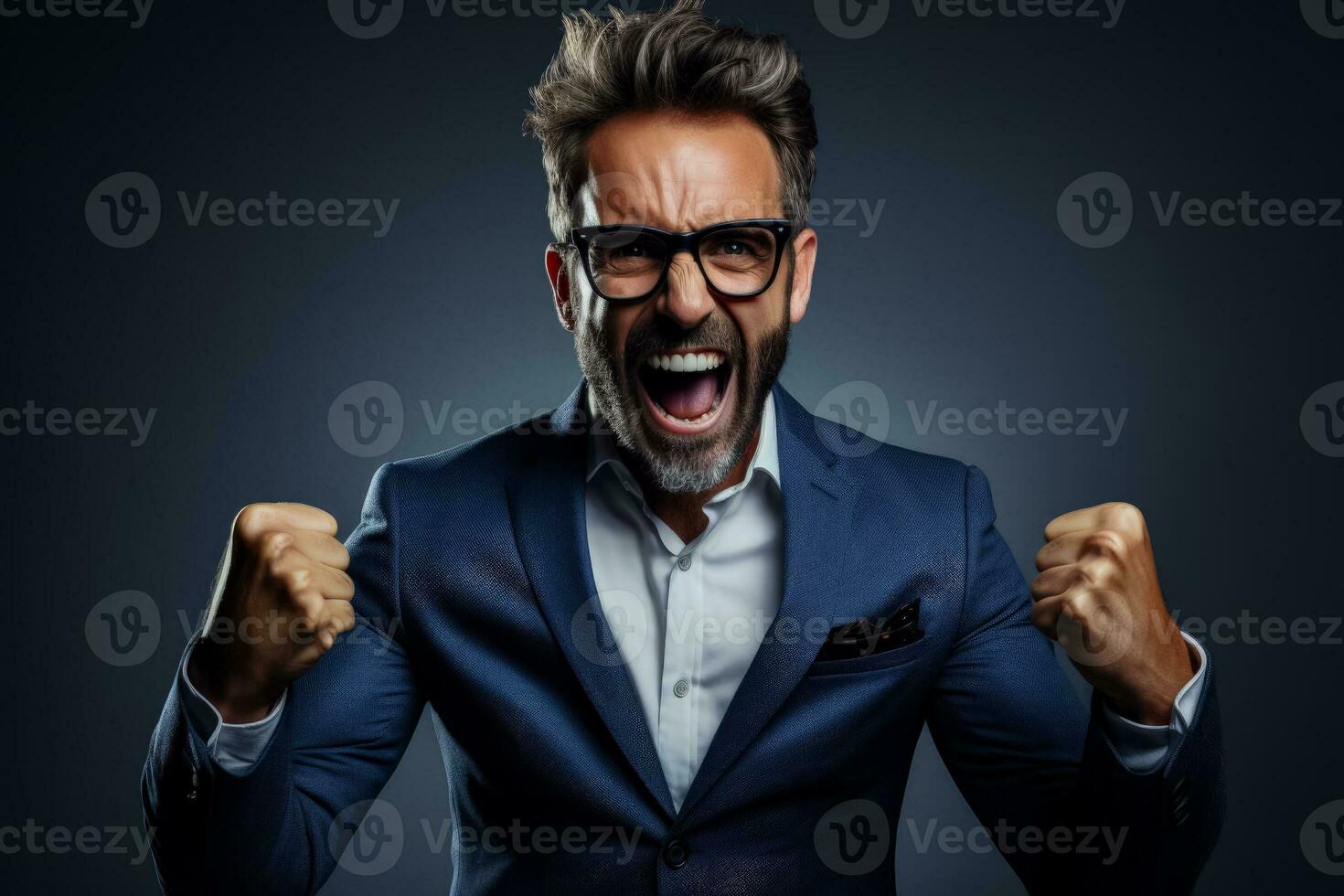 Excited male portrait celebrating success with a triumphant fist photo