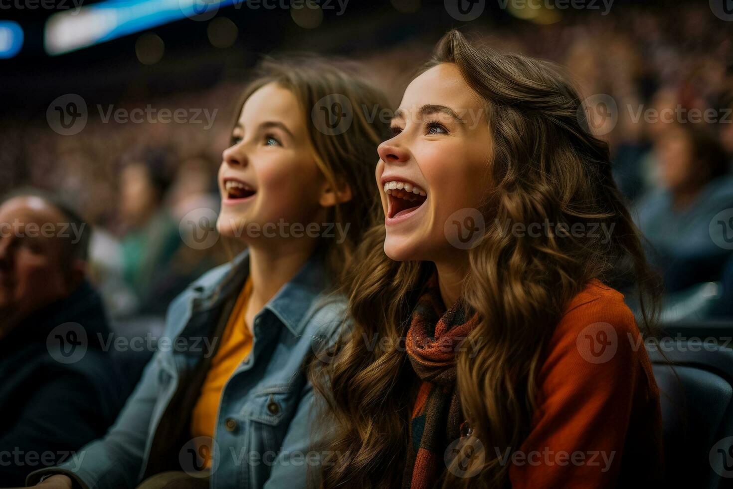 Supportive mother enthusiastically cheers for her daughters team during games photo