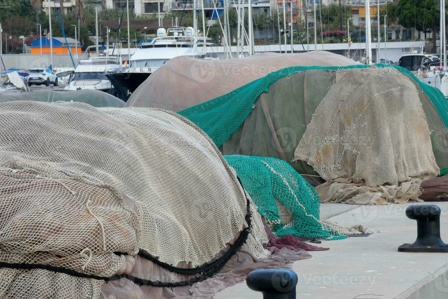 Fishing nets stretched out in the harbour photo