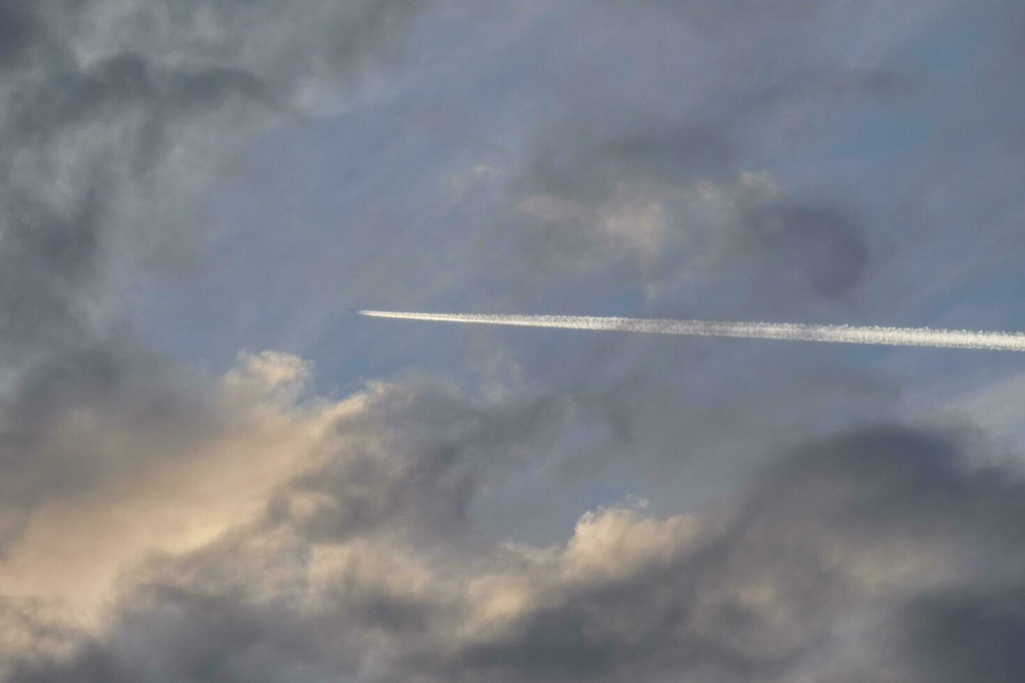 Scattered clouds in the sky indicating a change in weather. photo