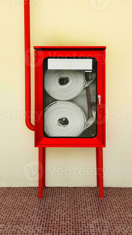 Fire extinguishing system on background wall, powerful emergency equipment for industry photo