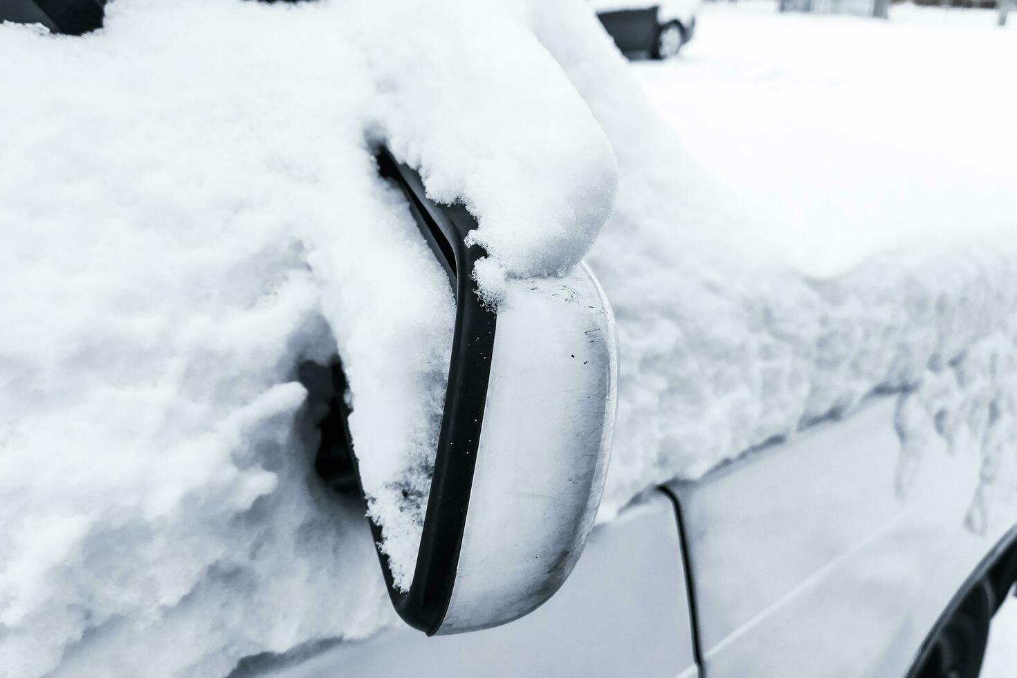 Car in winter in the snow, Cleaning the car photo