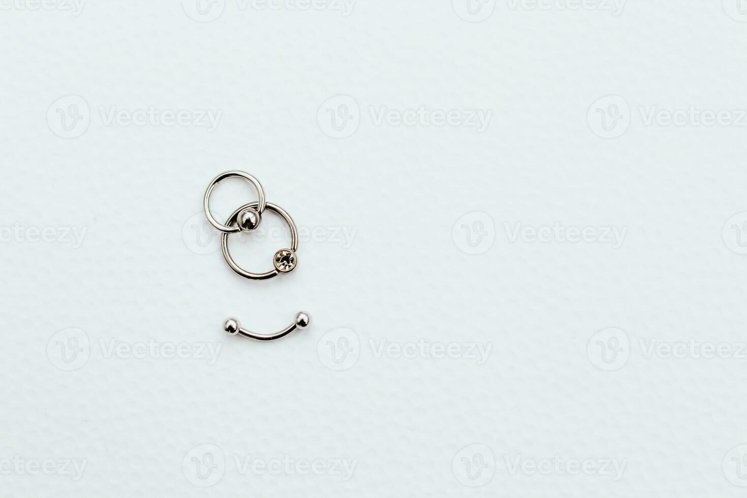 Earrings and rings made of medical steel for piercing photo