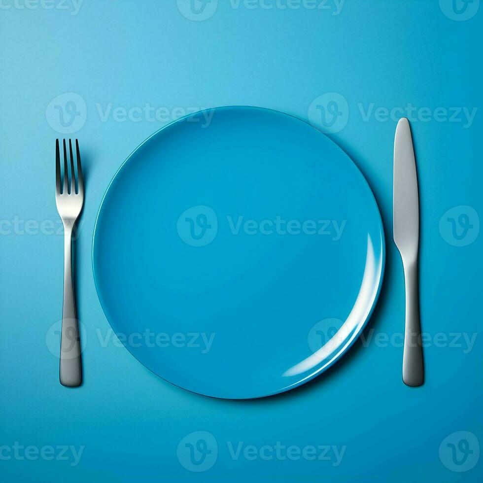 Blue ceramic plate with fork and knife lying next to on blue background. High resolution. AI Generative photo