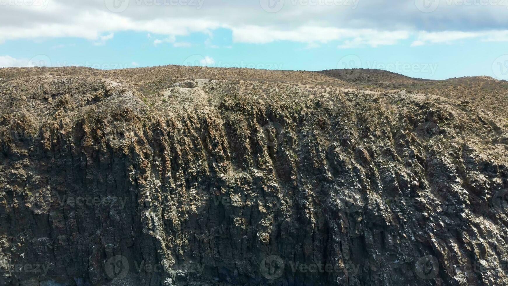 Large rock formations that look like Los Gigantes right on the atlantic ocean on the Canary Island of Tenerife. photo