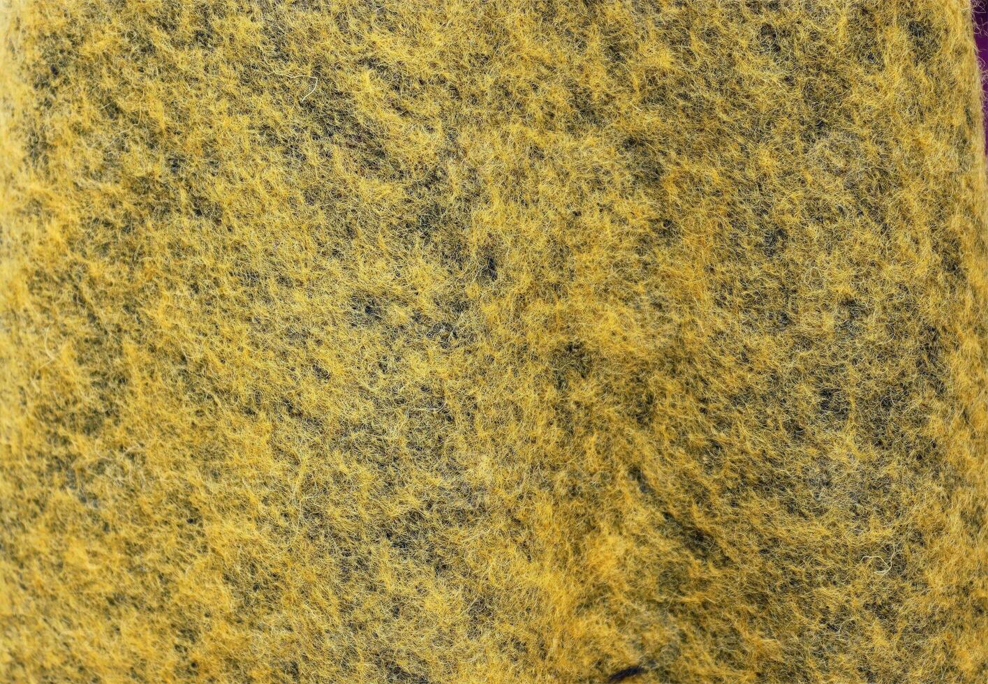 Detailed close up view on samples of cloth and fabrics in different colors found at a fabrics market photo