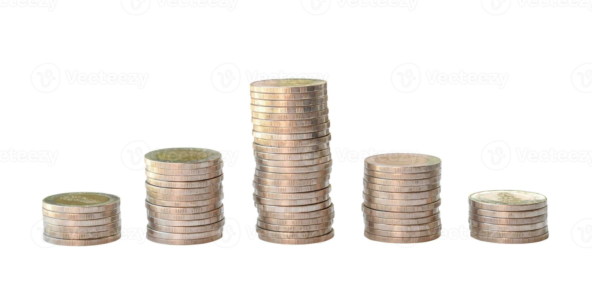 Silver coins in separated stacks isolated on white background with clipping path. Money growth concept in investment and saving money photo