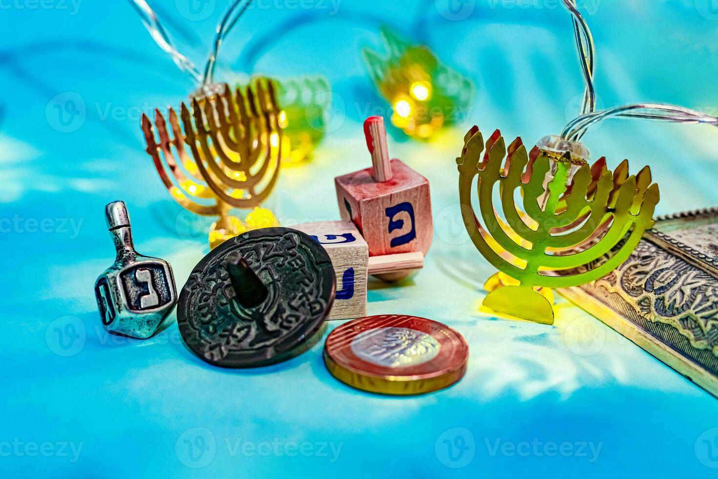 Close up of dreidel and menorah yellow Hanukkah. photo