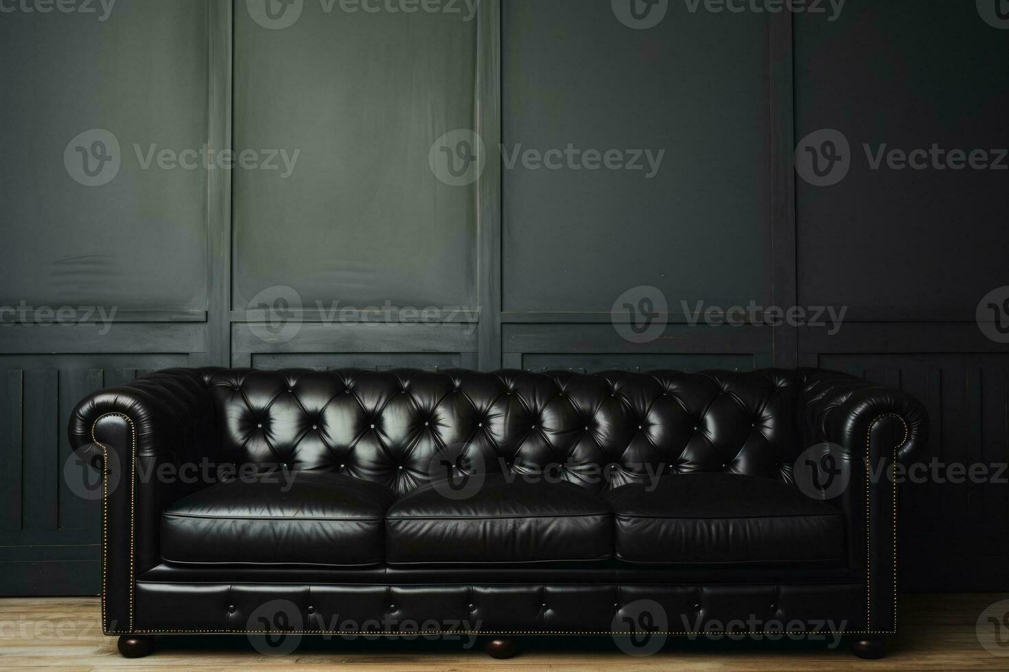 Black sofa against white wall background in close up shot photo