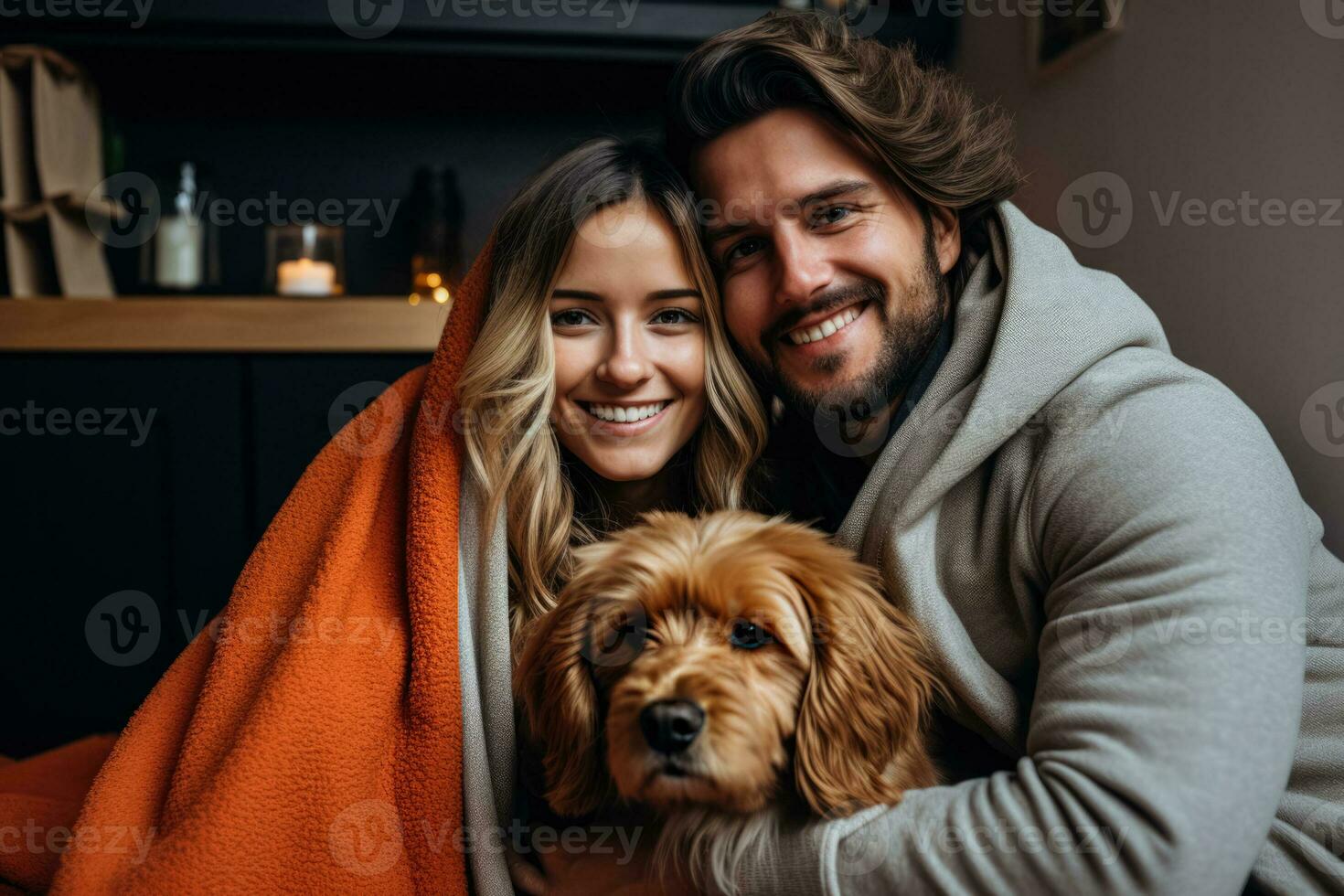 Relaxed couple enjoys home life with their loving dog and laptop photo