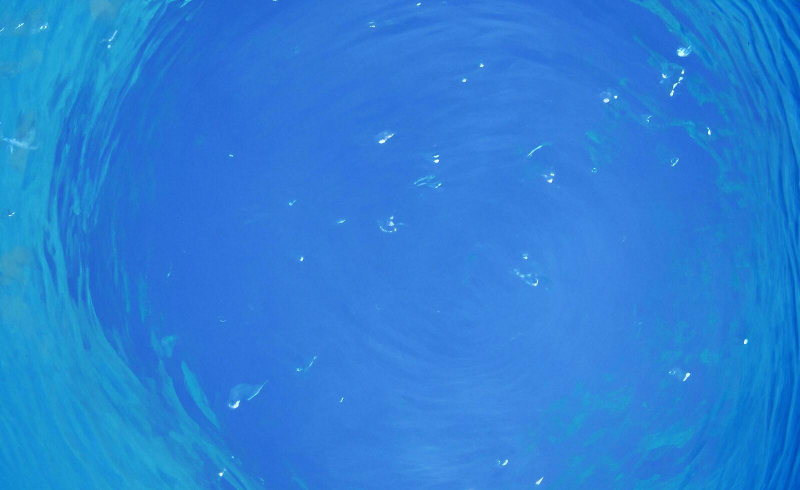 Blue water surface background photo