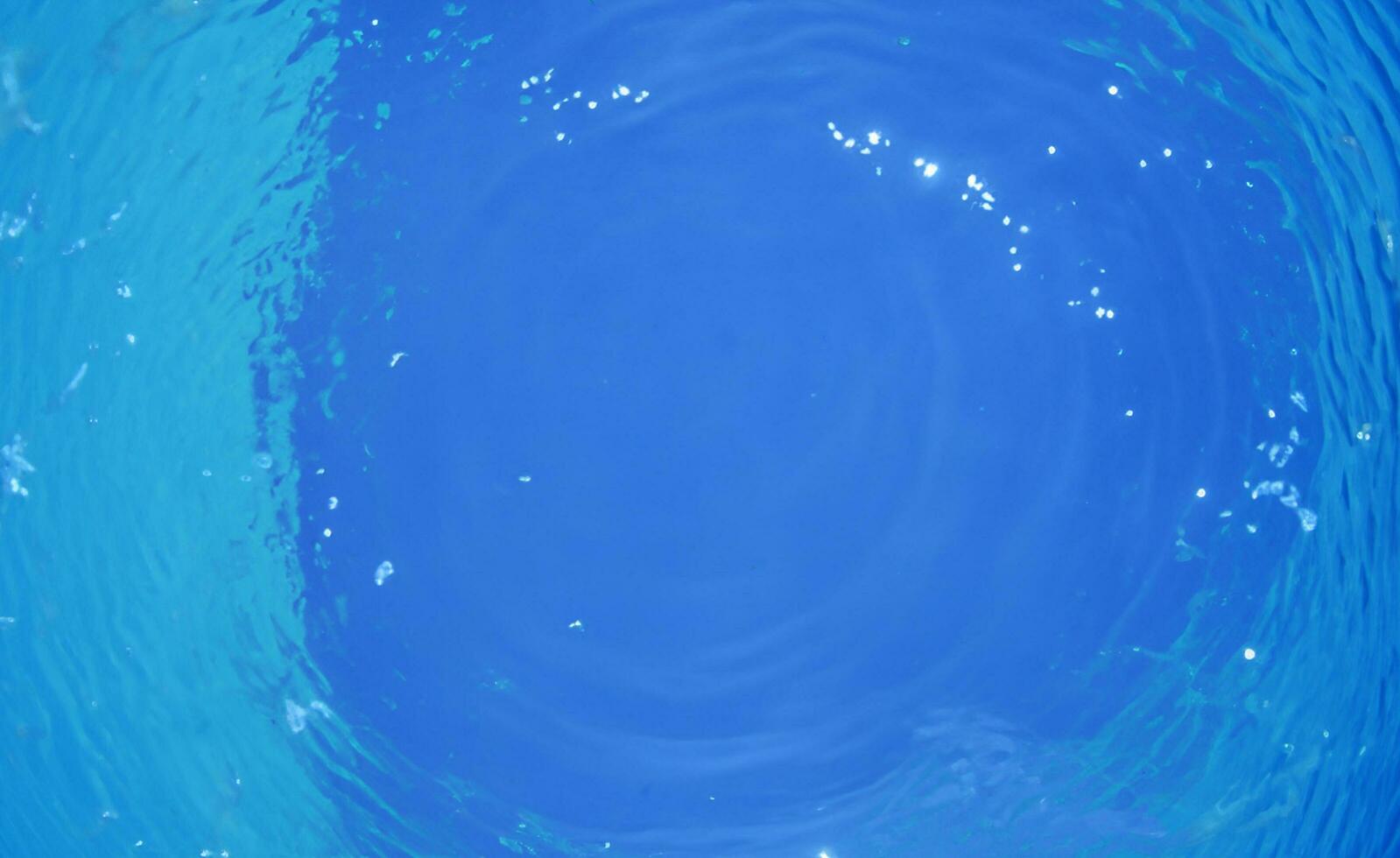 Blue water surface background photo