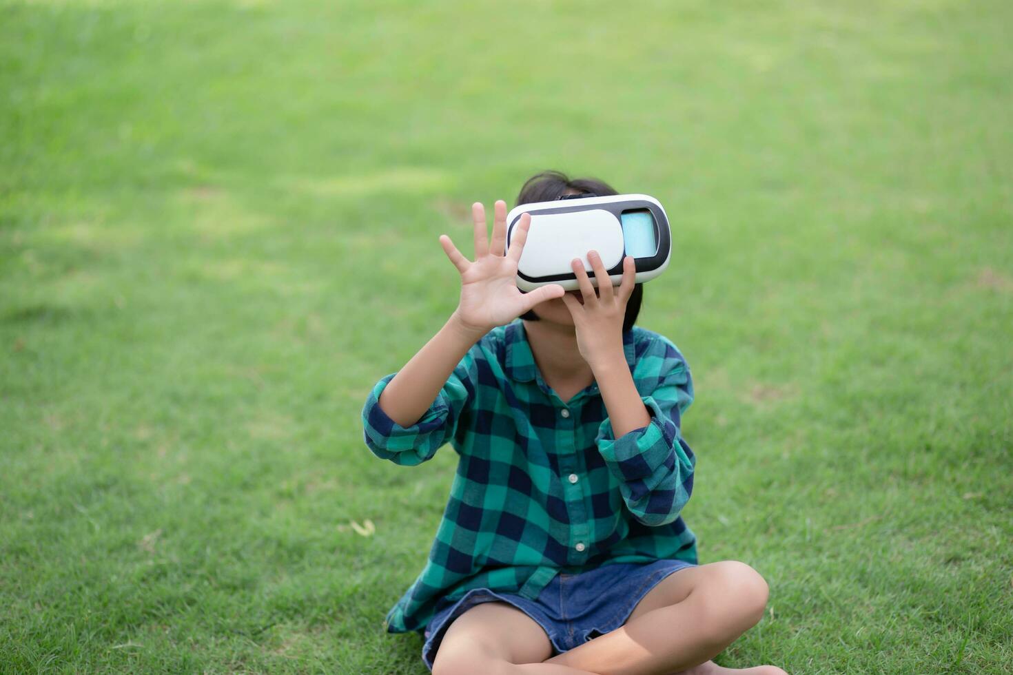 Young girl kid child play virtual reality game hold vr glasses and surprised. Cyber space and virtual gaming .SSTKHome photo