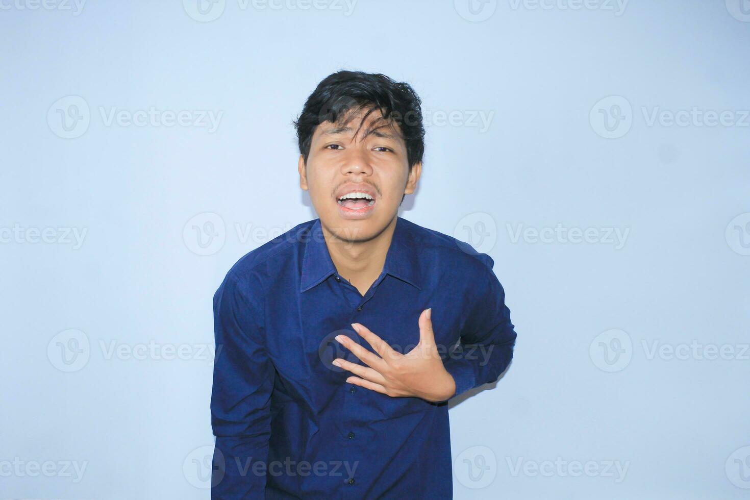 heart attack, asian office worker holding his chest suffering from heart pain caused stressful job. isolated white photo