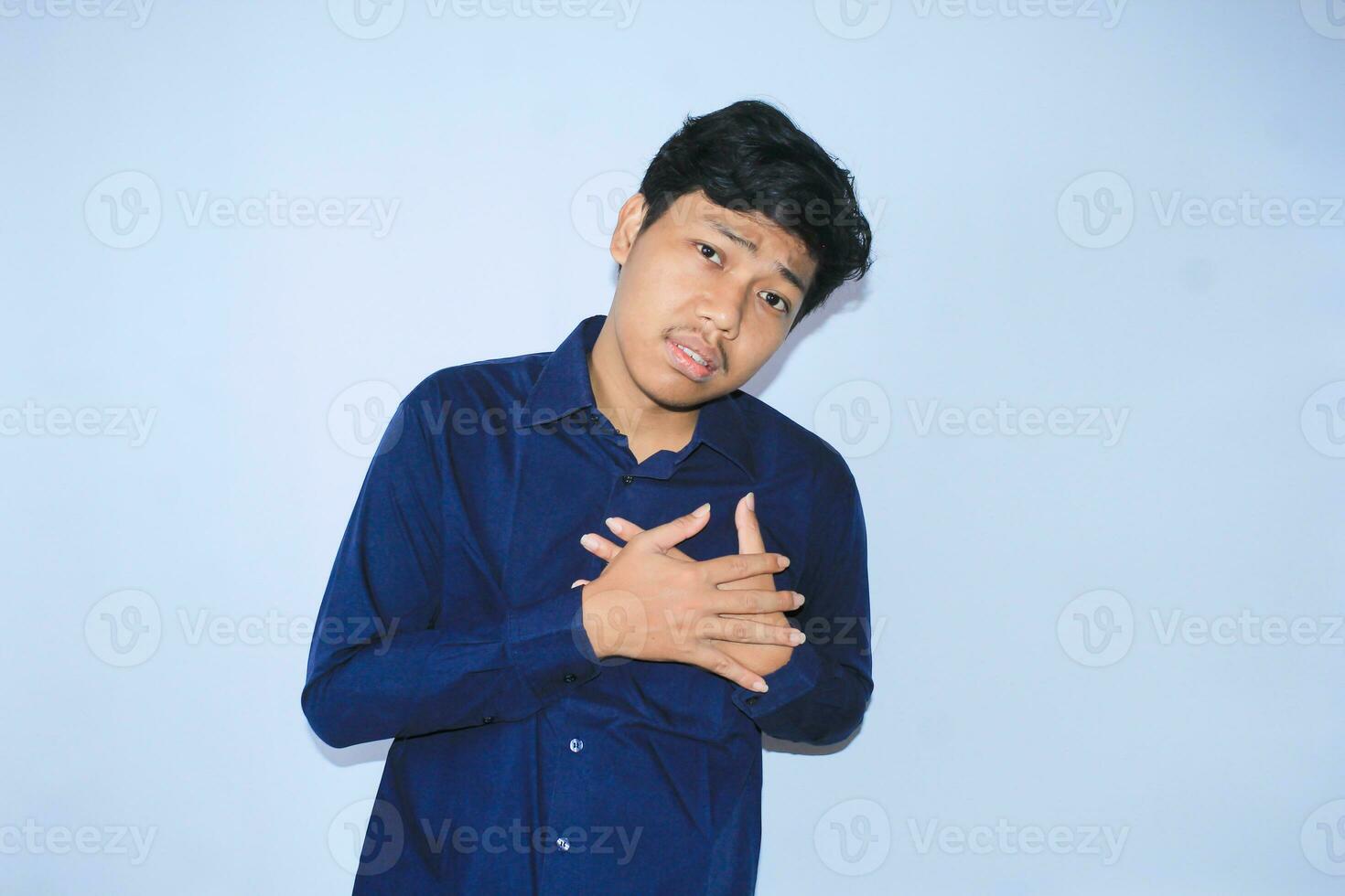 heart attack, asian office worker holding his chest suffering from heart pain caused stressful job. isolated white photo