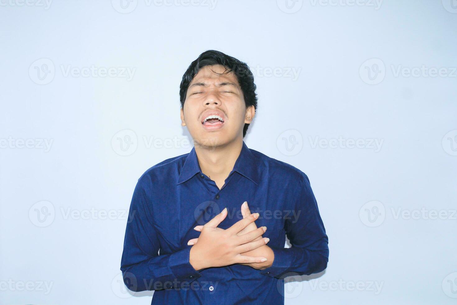 heart attack, asian office worker holding his chest suffering from heart pain caused stressful job. isolated white photo