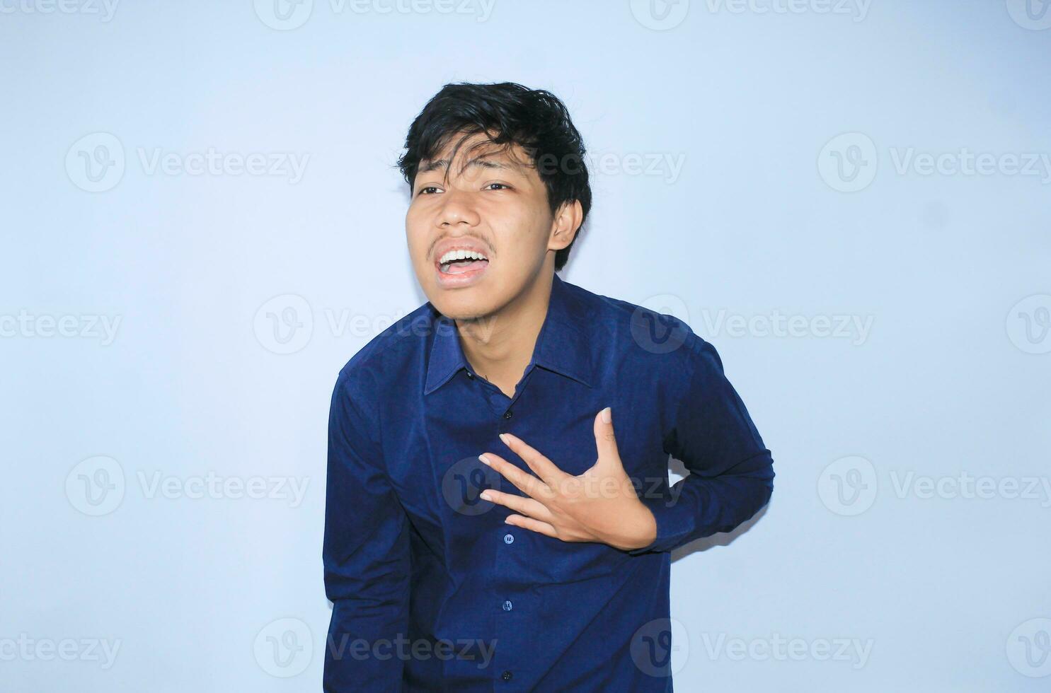 heart attack, asian office worker holding his chest suffering from heart pain caused stressful job. isolated white photo