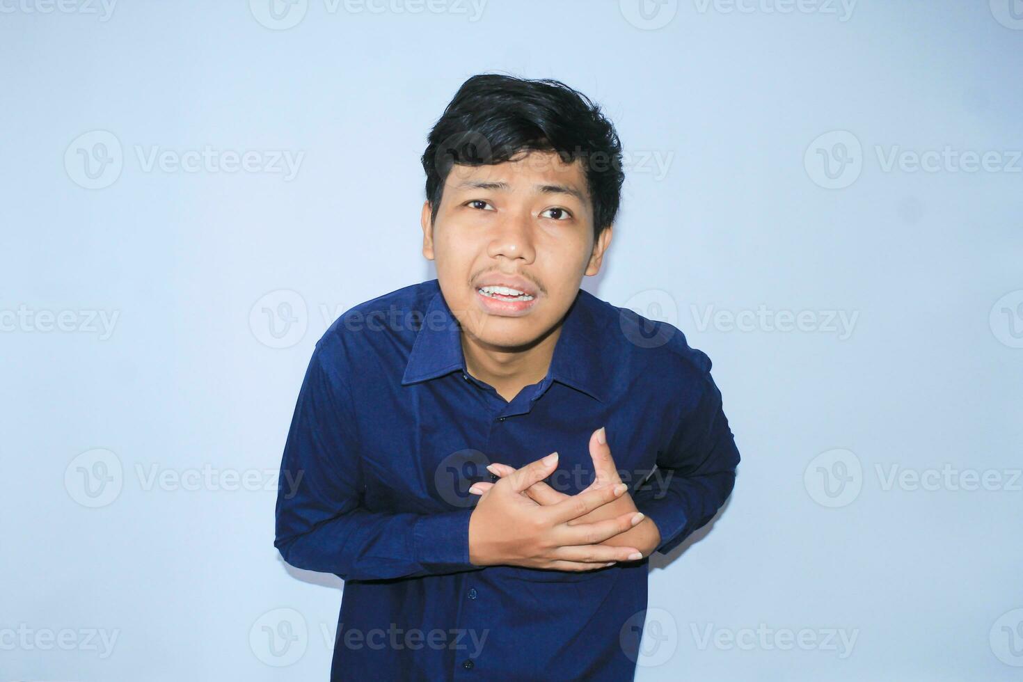 heart attack, asian office worker holding his chest suffering from heart pain caused stressful job. isolated white photo