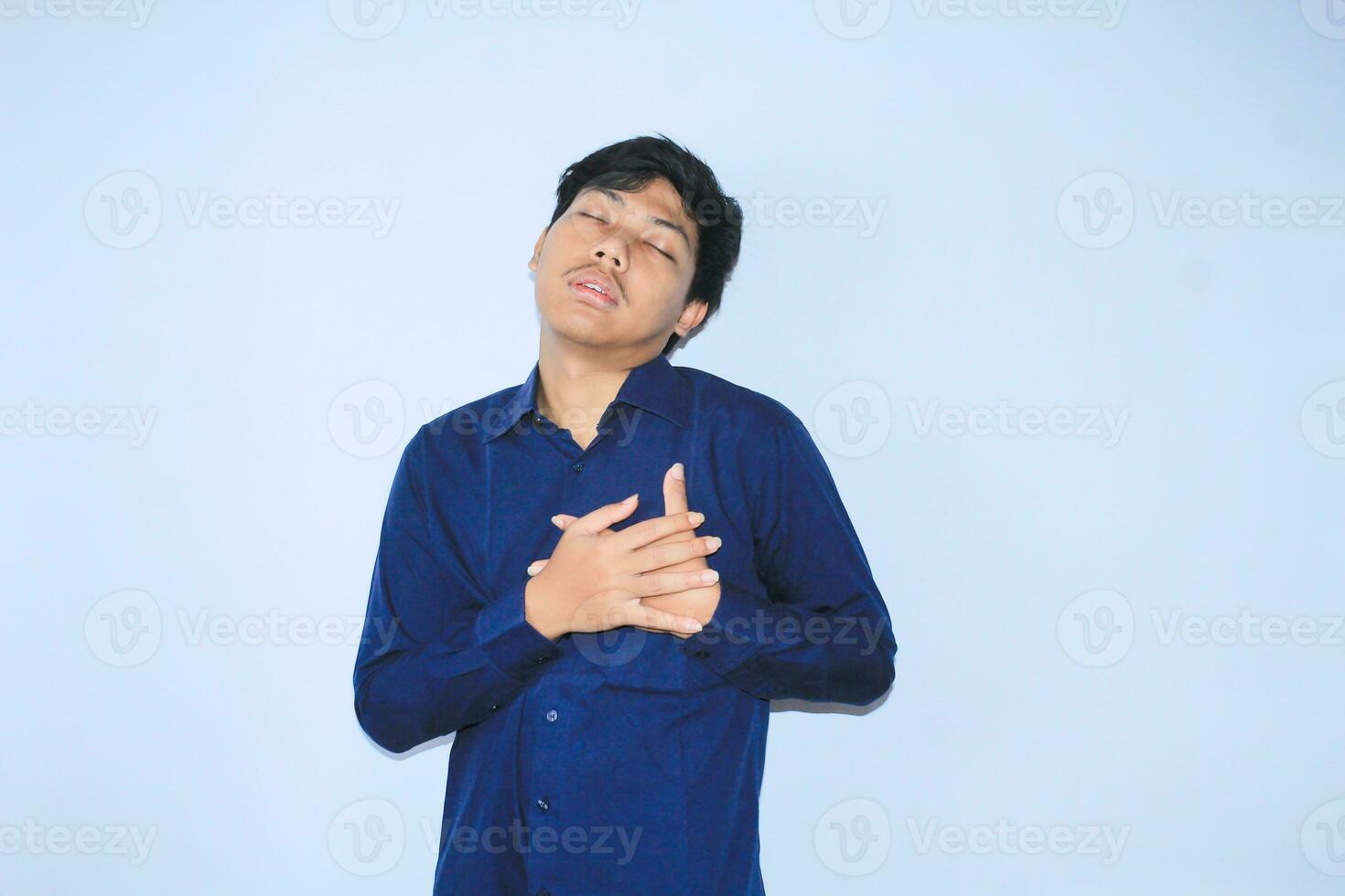 weak asian man office worker is unconscious and get heart attacked after working over time with close eyes photo