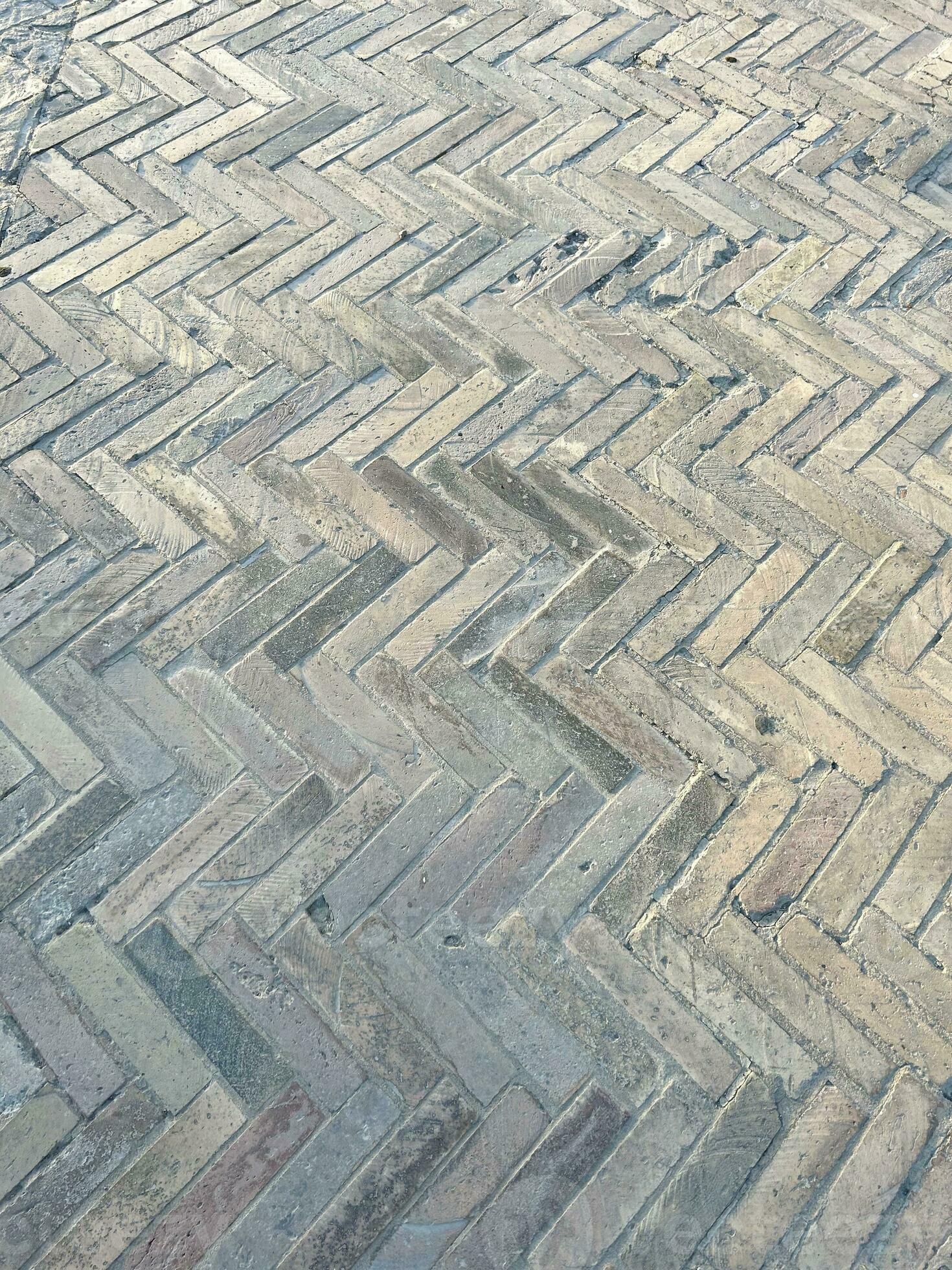 Tiled public space as parquet flooring, paving the street in gray