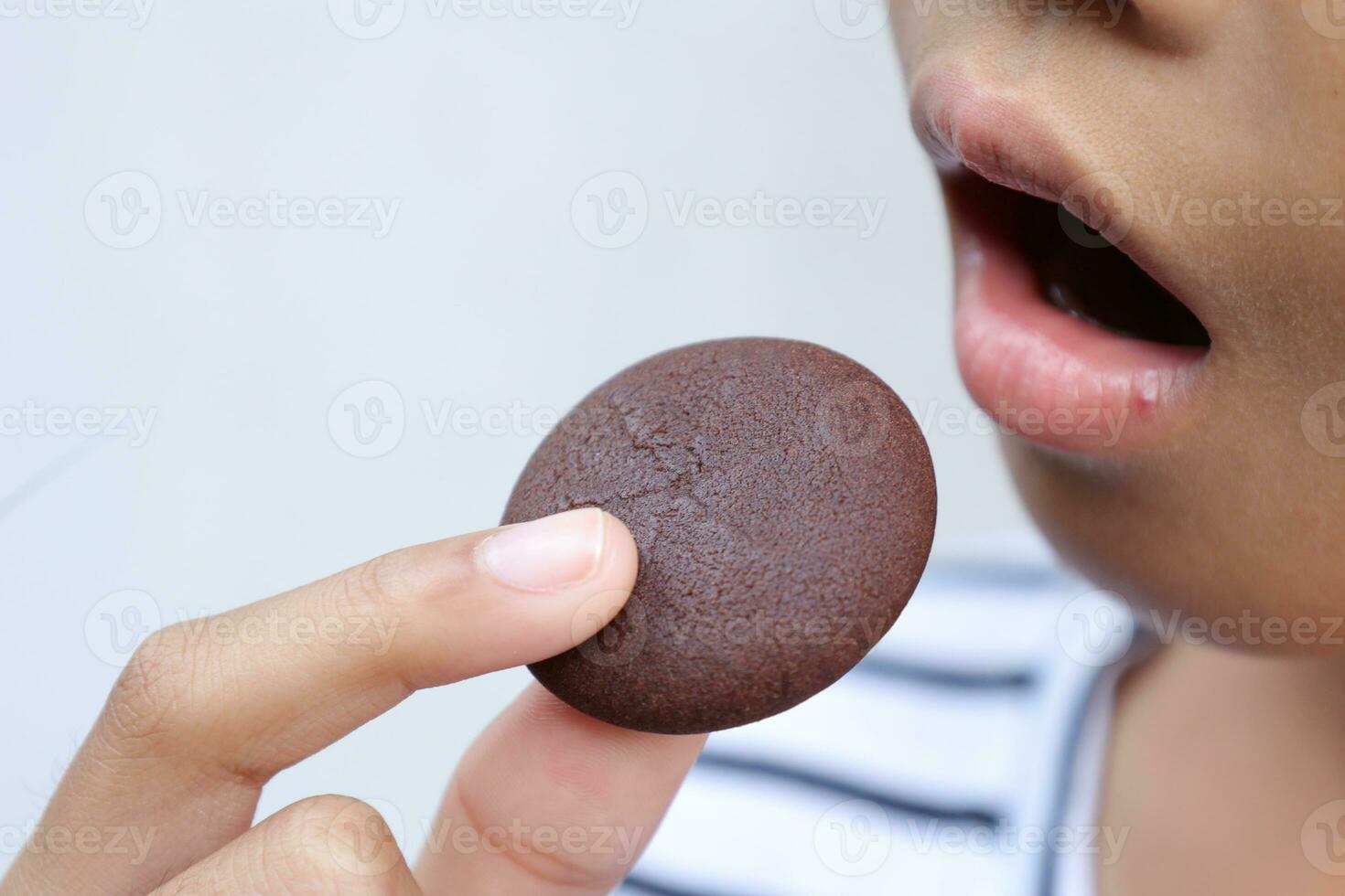 Close-up view of mouth eating food photo