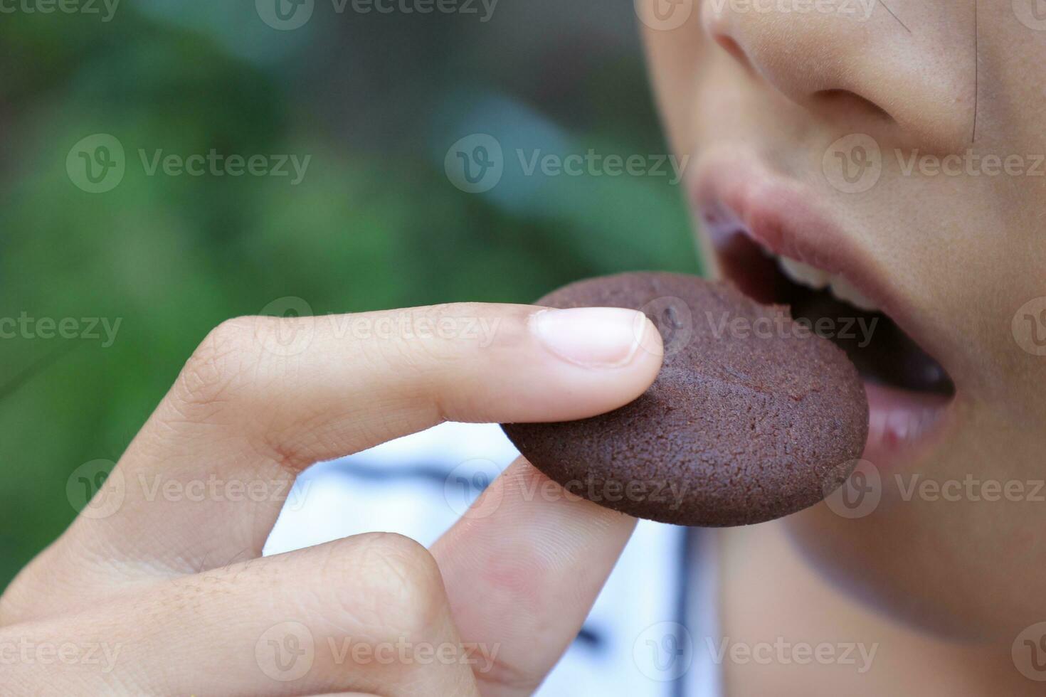 Close-up view of mouth eating food photo