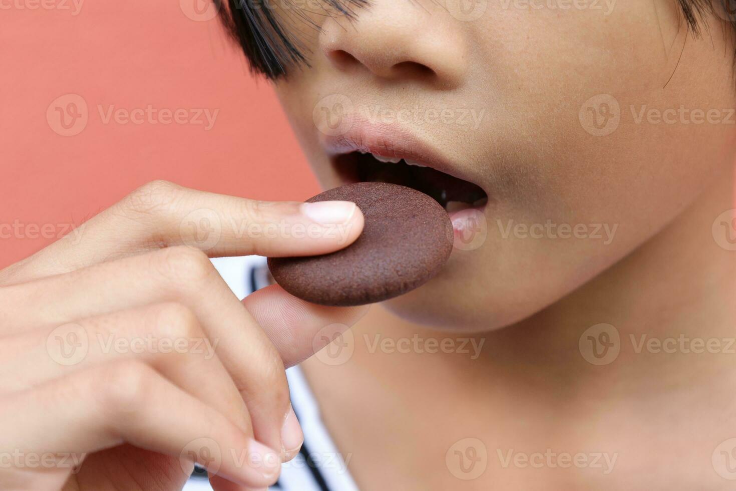 Close-up view of mouth eating food photo