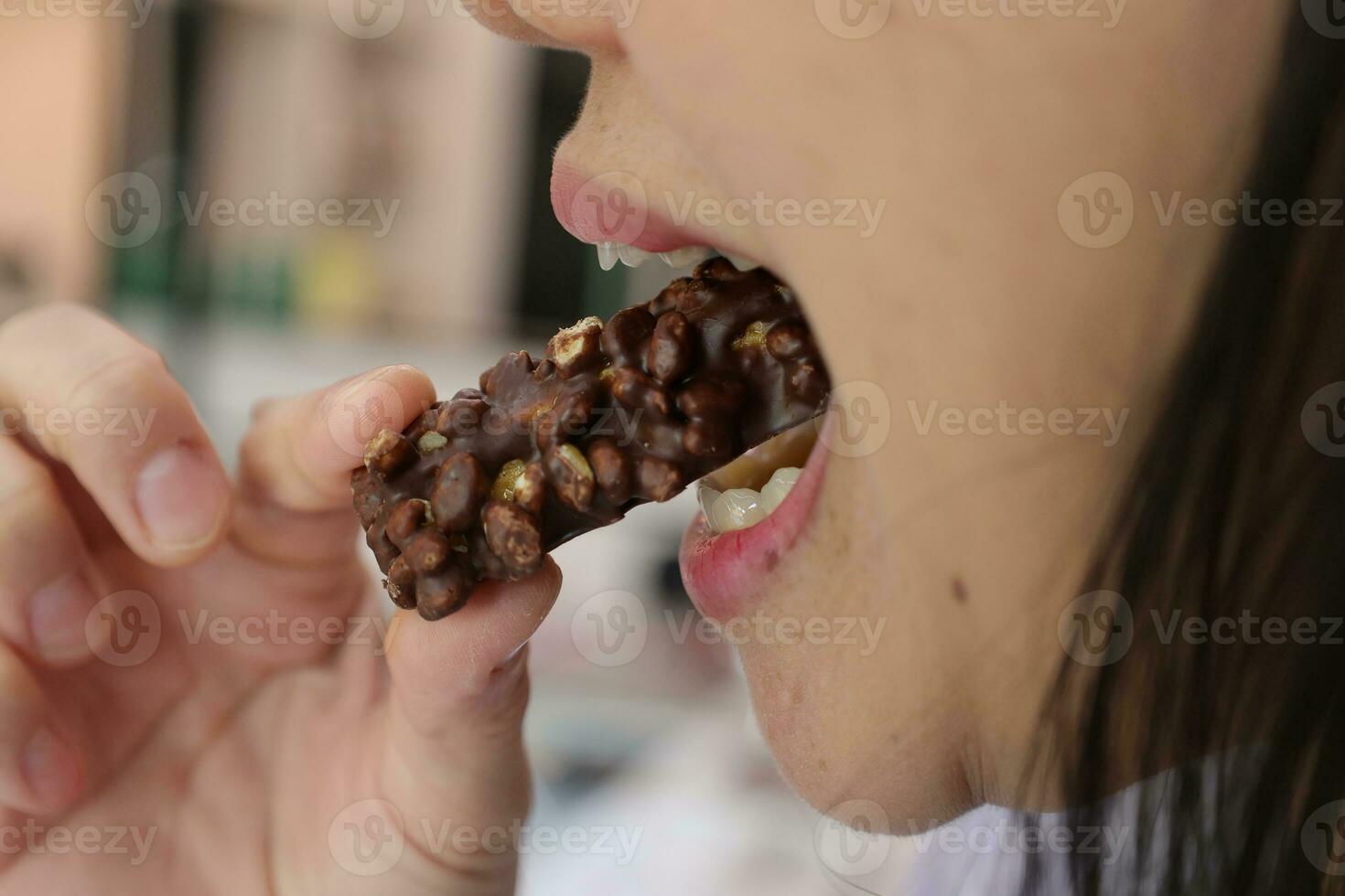 Close-up view of mouth eating food photo
