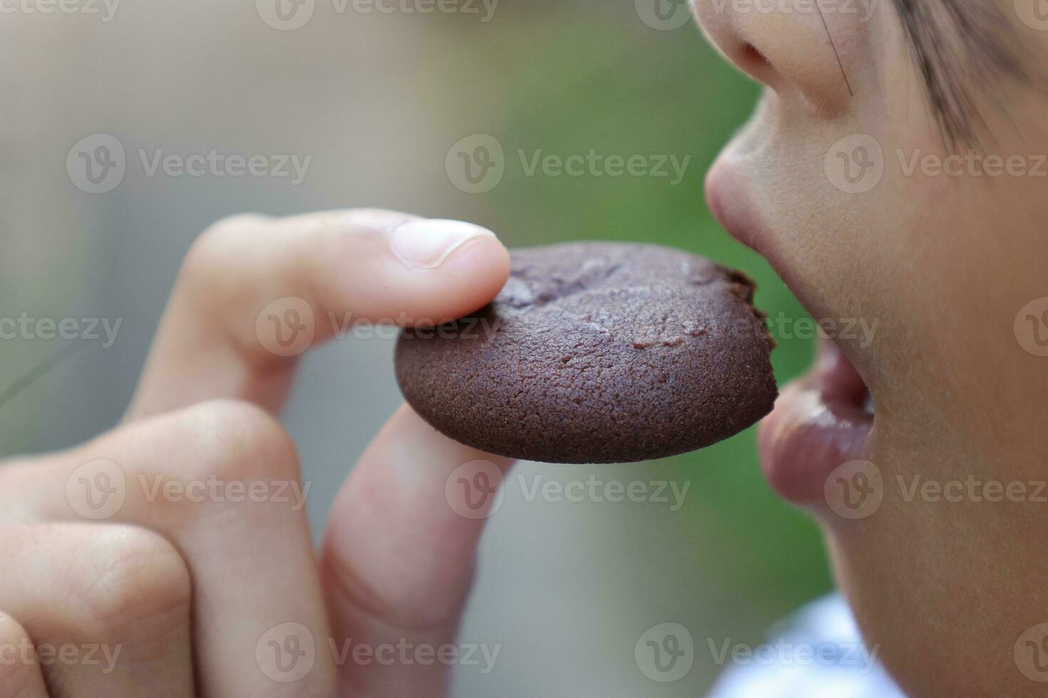 Close-up view of mouth eating food photo