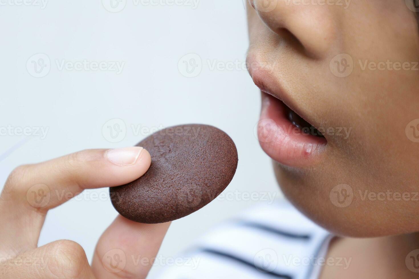 Close-up view of mouth eating food photo